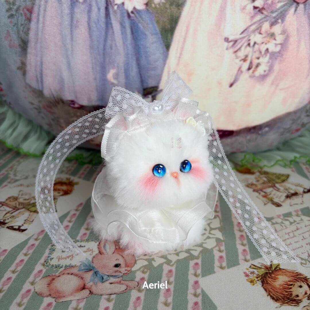Handmade kitten from the Fairy Paws Collection, fluffy white cat figurine with blue eyes and a lace ribbon.