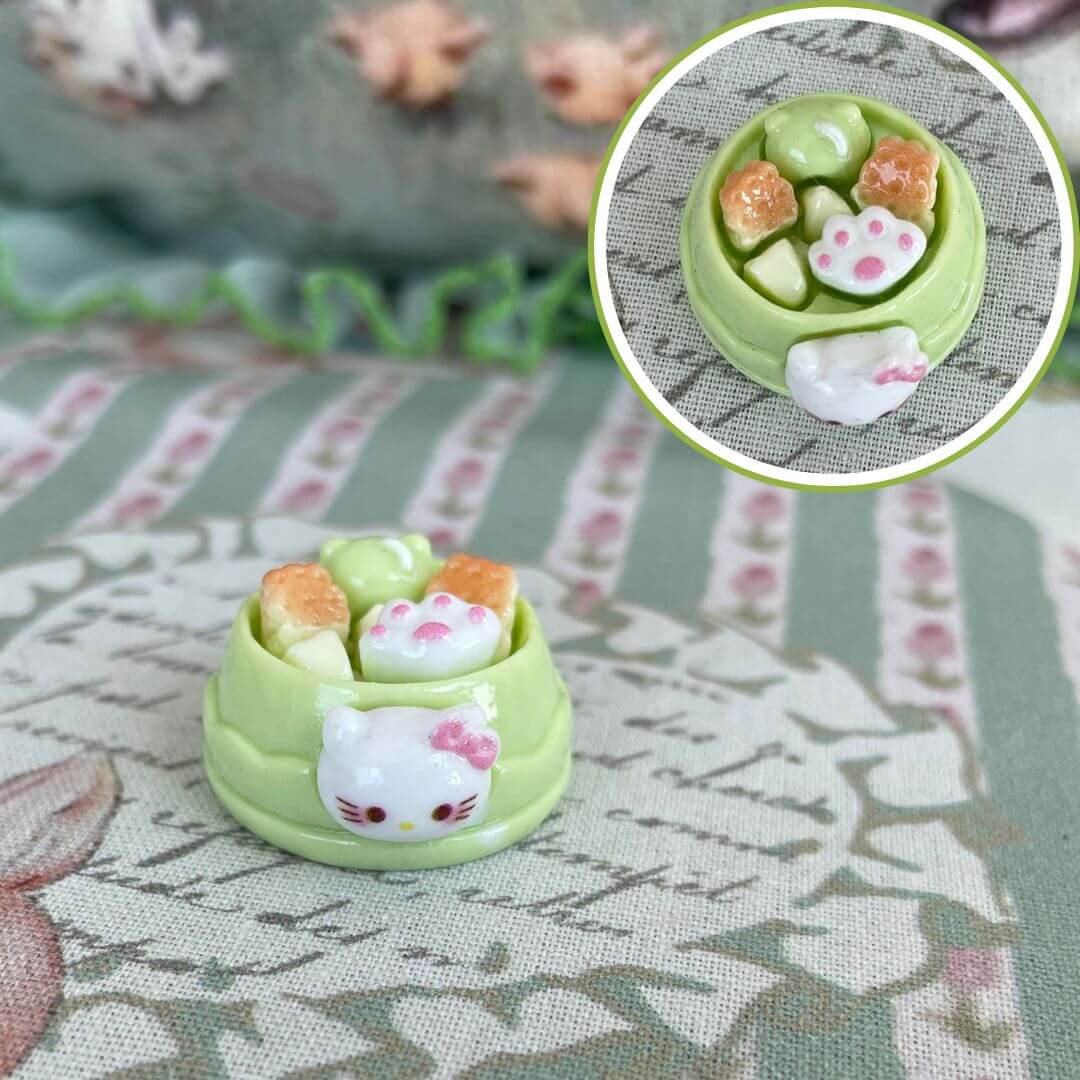 Cute handmade plush creamy kitties in a green dessert bowl, perfect for fancy feline-themed decor or accessories.