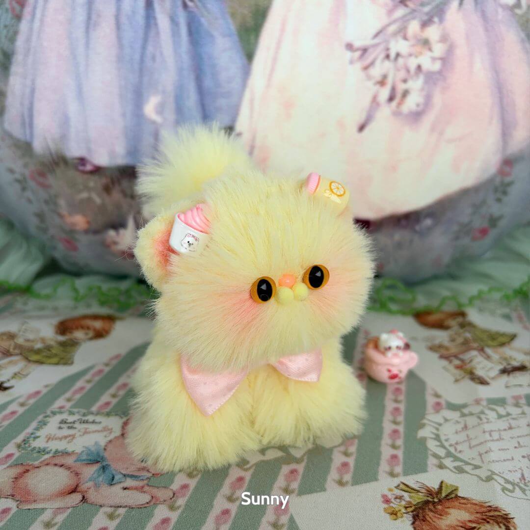 Fluffy Kitten Collection: kawaii yellow fluffy kitten figurine with pastel sweet accessories and a pink bow.