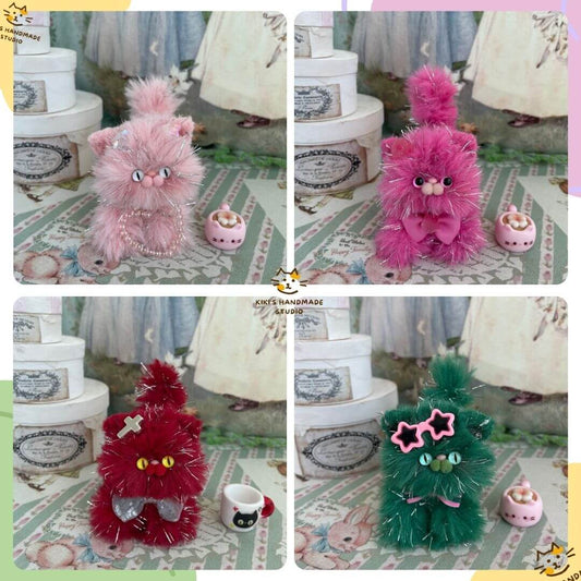 Handmade Twinkling Kitten Collection plush toys in pink, red, and green with glittering accents, displayed on a decorative background.