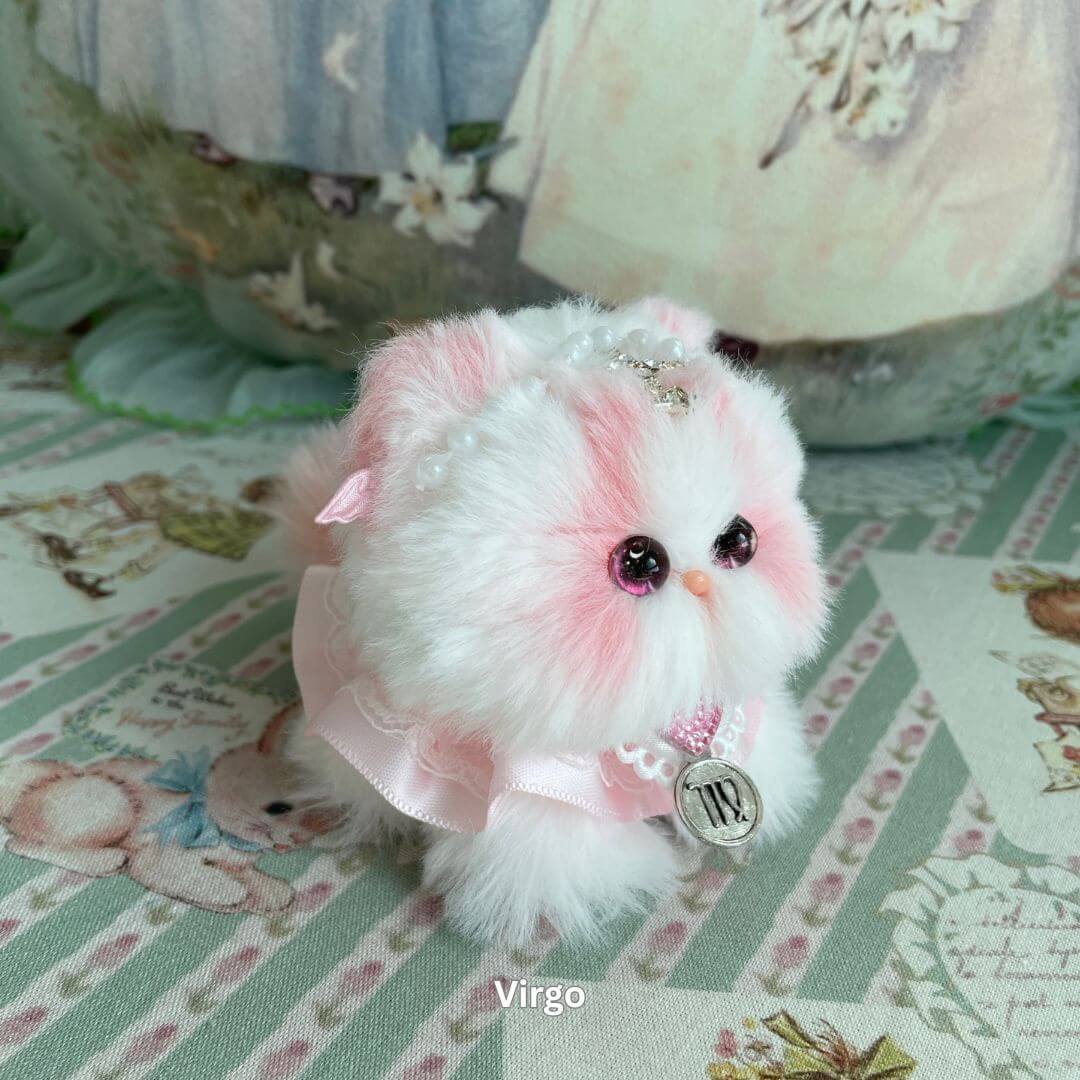 Handmade Virgo zodiac kitten plush toy with pink faux fur, pearl accessories, and horoscope charm.